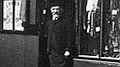 Close-up of Mr Robert Old standing on the threshold of number 14 Friar Street