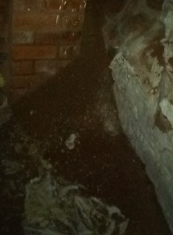 Pile of sand showing the erosion of soft sandstone in Tudor House Museum cellars