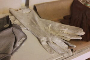 A pair of white gloves manufactured in Worcester